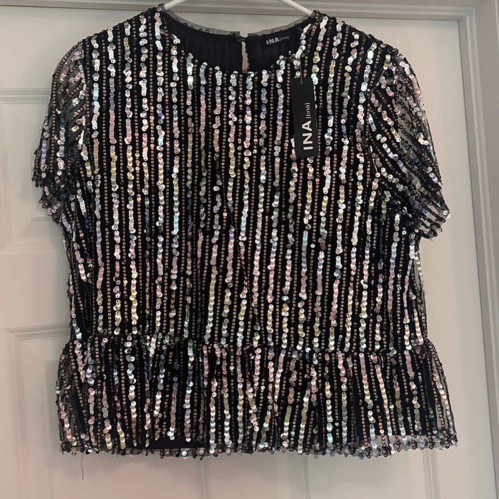 New with tags; INA Peplum sequin top.
